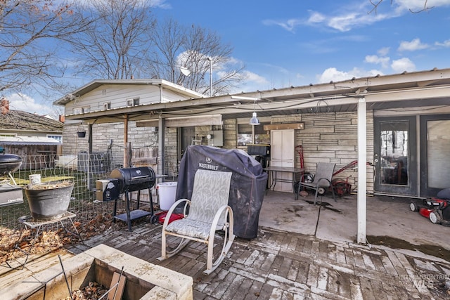 wooden deck featuring fence, area for grilling, and a patio area