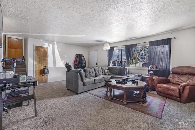 carpeted living area with a textured ceiling