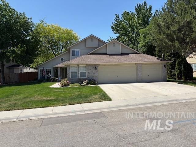 3707 N Jullion Way, Boise, ID 83704 - traditional-style house featuring a garage, driveway, and a shingled roof