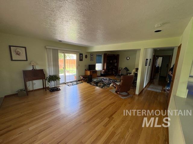 3707 N Jullion Way, Boise, ID 83704 - living area with wood finished floors and a textured ceiling
