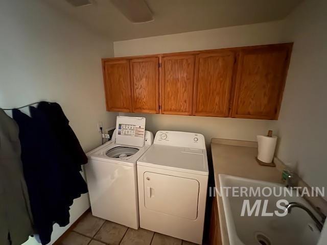 3707 N Jullion Way, Boise, ID 83704 - washroom with cabinet space, washing machine and clothes dryer, and light tile patterned floors