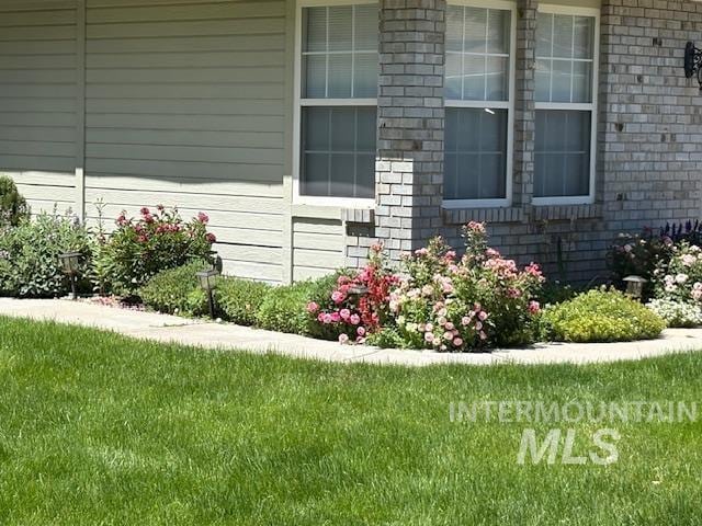 3707 N Jullion Way, Boise, ID 83704 - entrance to property with brick siding and a lawn