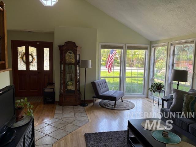 3707 N Jullion Way, Boise, ID 83704 - living room featuring vaulted ceiling and light wood finished floors