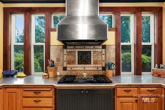 204 7th Ave N, Twin Falls, ID 83301 - kitchen with ventilation hood, black gas stovetop, and tasteful backsplash