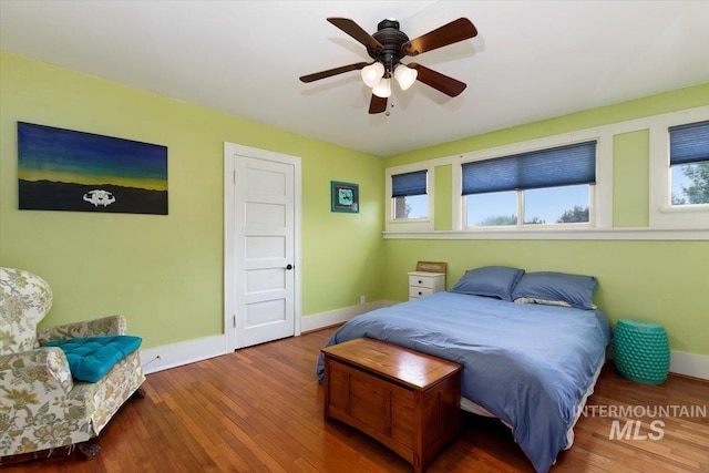 204 7th Ave N, Twin Falls, ID 83301 - bedroom with baseboards, wood finished floors, and ceiling fan