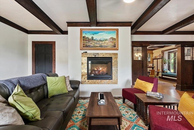 204 7th Ave N, Twin Falls, ID 83301 - living room featuring wood finished floors, beamed ceiling, and a glass covered fireplace