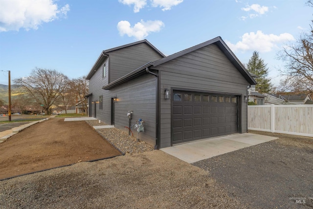 view of side of property with a garage