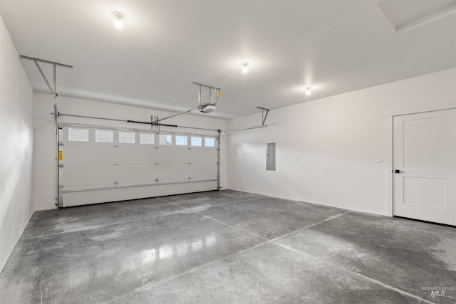 garage featuring a garage door opener and electric panel