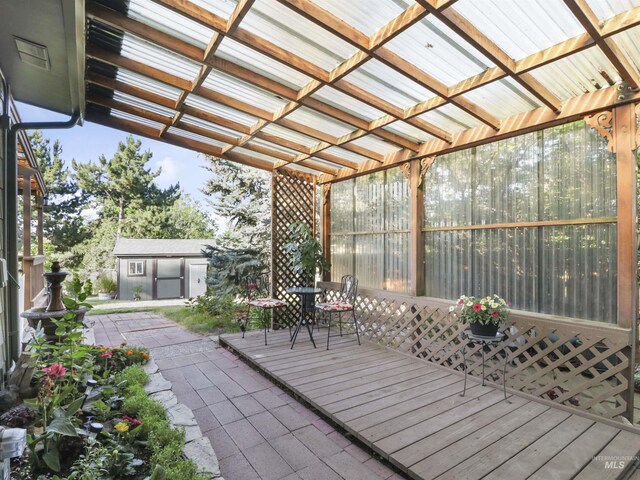 143 E Morris Ct, Kuna, ID 83634 - view of patio featuring a deck, a shed, and outdoor dining area