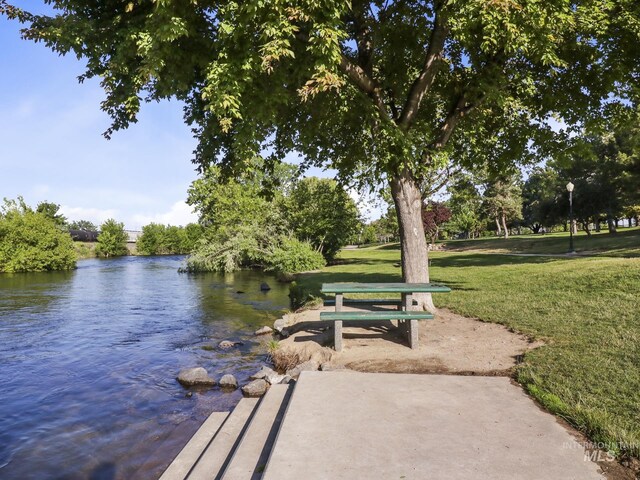 143 E Morris Ct, Kuna, ID 83634 - dock area with a lawn and a water view