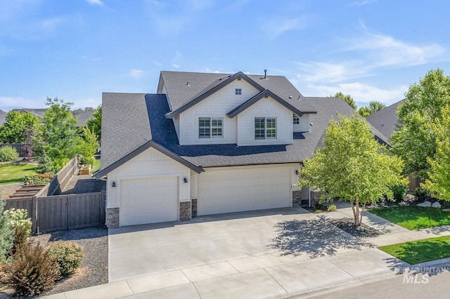 1864 N Highbury Way, Eagle, ID 83616 - craftsman inspired home with stone siding, a shingled roof, a garage, driveway, and a gate