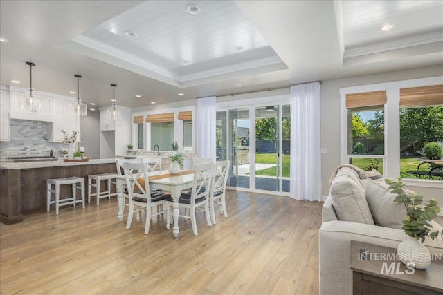 1864 N Highbury Way, Eagle, ID 83616 - dining room with a raised ceiling, light wood-type flooring, recessed lighting, and ornamental molding