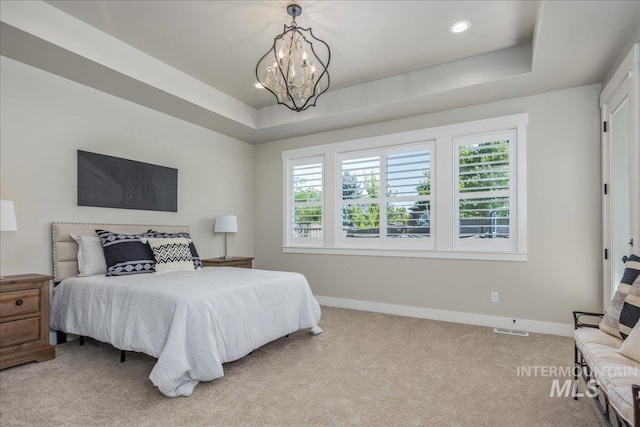 1864 N Highbury Way, Eagle, ID 83616 - bedroom featuring carpet flooring, multiple windows, a chandelier, a tray ceiling, and recessed lighting