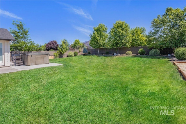 1864 N Highbury Way, Eagle, ID 83616 - fenced backyard with a patio and a hot tub
