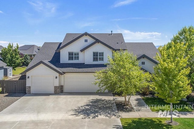 1864 N Highbury Way, Eagle, ID 83616 - view of front of property with a garage, roof with shingles, concrete driveway, and stone siding