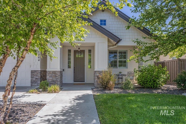 1864 N Highbury Way, Eagle, ID 83616 - view of front facade with stone siding and a garage