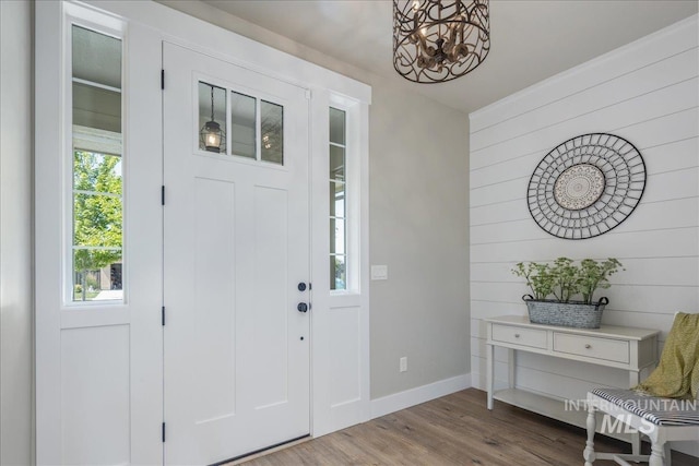 1864 N Highbury Way, Eagle, ID 83616 - entrance foyer with wood finished floors, wood walls, and a chandelier