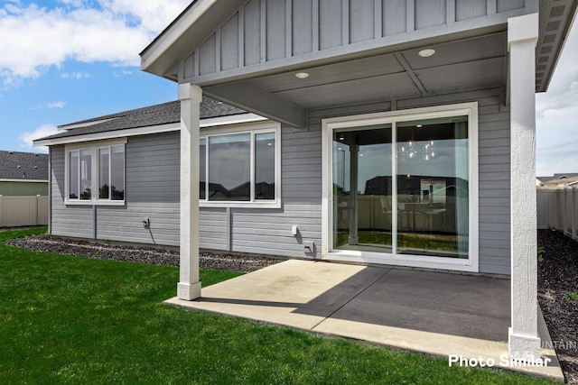 5511 E Bridal Veil Falls Dr, Nampa, ID 83686 - view of home's exterior featuring board and batten siding, a patio, and roof with shingles