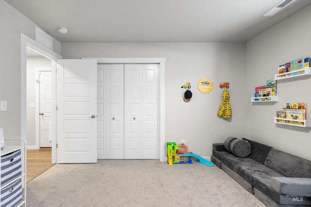 rec room with visible vents and carpet floors