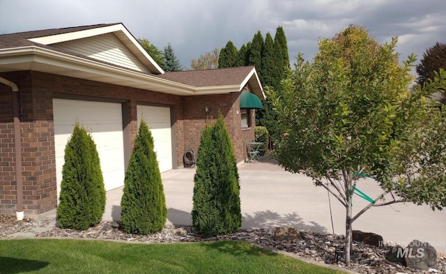 view of property exterior with a garage