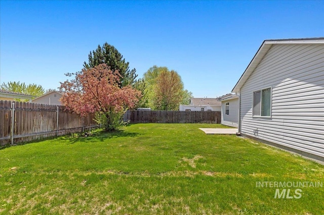 view of yard with a fenced backyard