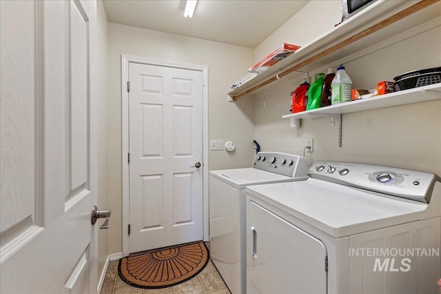 clothes washing area featuring laundry area and washing machine and dryer