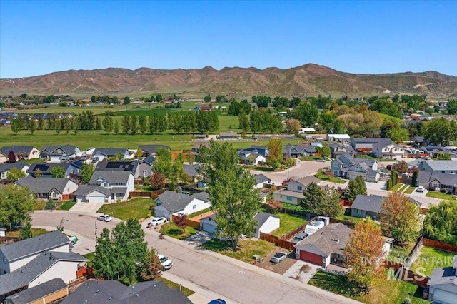 aerial view featuring a mountain view and a residential view