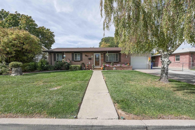 view of front of home featuring a garage and a front lawn