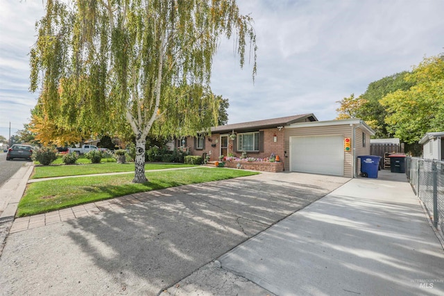 view of front of property with a front lawn and a garage