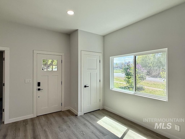 304 N C St, Grangeville, ID 83530 - entrance foyer with wood finished floors, baseboards, and recessed lighting