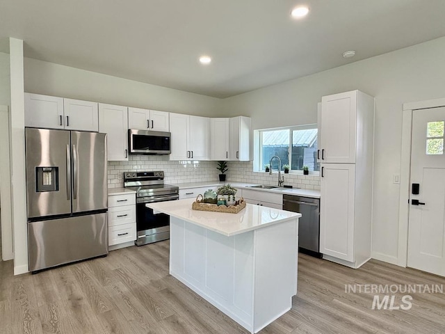 304 N C St, Grangeville, ID 83530 - kitchen with appliances with stainless steel finishes, a sink, light wood-style flooring, light countertops, and recessed lighting