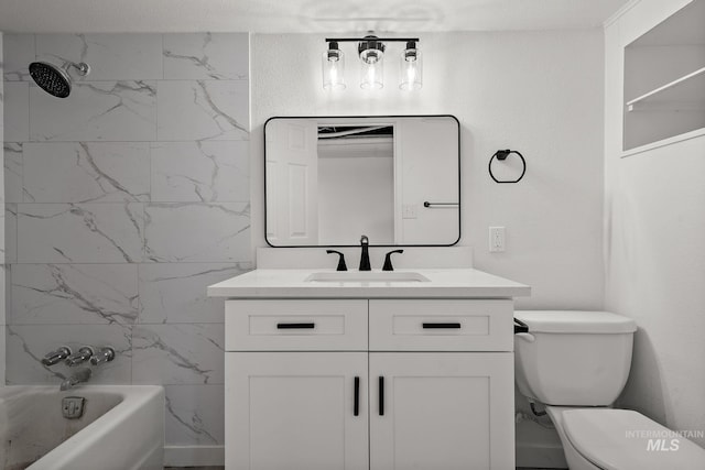 full bathroom featuring tiled shower / bath combo, vanity, and toilet