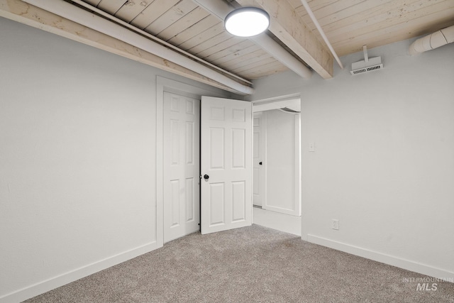 basement with carpet floors and wood ceiling