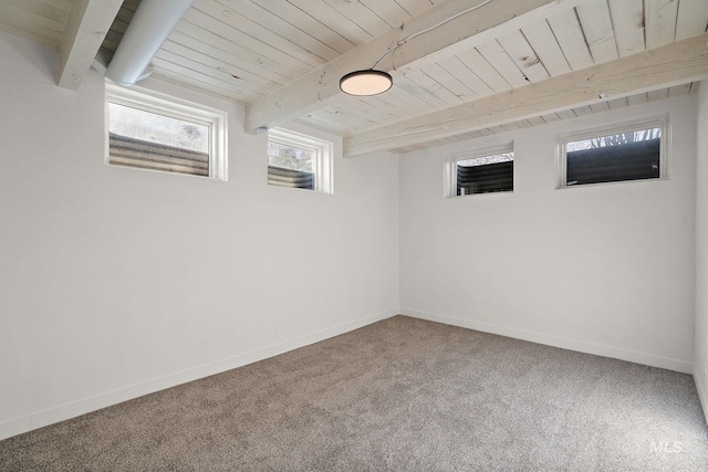 basement featuring wood ceiling and carpet