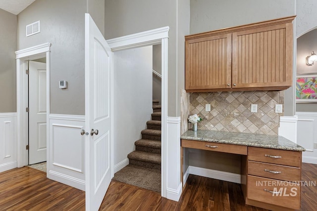 1928 E Mountain Man Dr, Meridian, ID 83646 - staircase featuring built in study area, wood finished floors, and visible vents