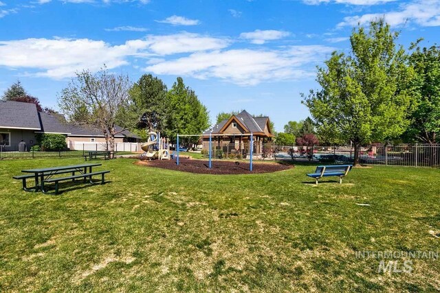 1928 E Mountain Man Dr, Meridian, ID 83646 - view of property's community with a yard, fence, and playground community
