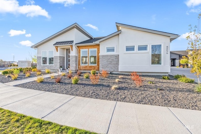 8456 W Meltwater Ln, Eagle, ID 83616 - view of front of house with stucco siding and stone siding