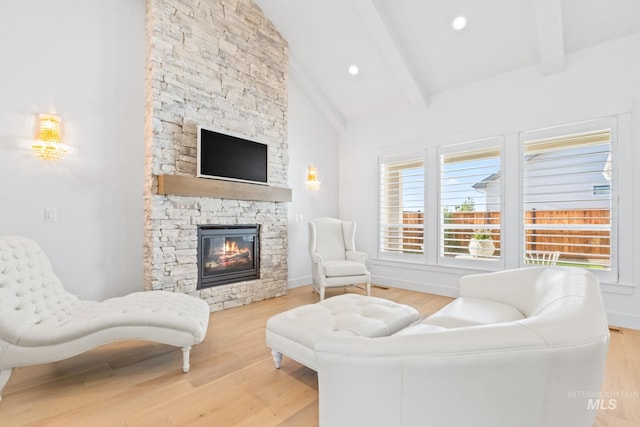 8456 W Meltwater Ln, Eagle, ID 83616 - living room with a fireplace, wood finished floors, and baseboards