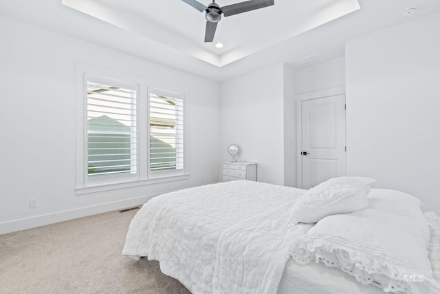 8456 W Meltwater Ln, Eagle, ID 83616 - bedroom featuring a raised ceiling, carpet floors, baseboards, ceiling fan, and recessed lighting