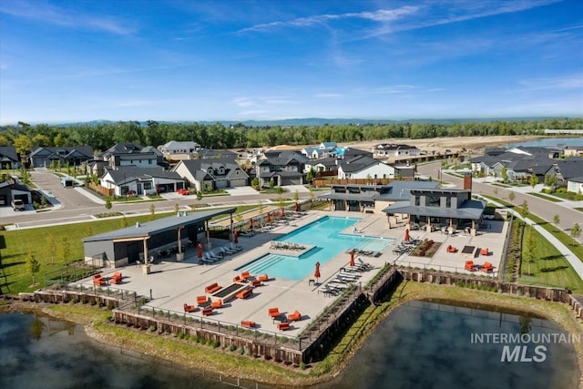 8456 W Meltwater Ln, Eagle, ID 83616 - aerial perspective of suburban area with a pool area and a large body of water