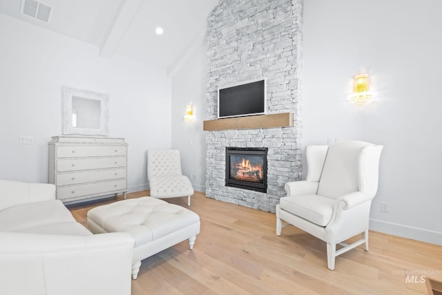 8456 W Meltwater Ln, Eagle, ID 83616 - living area with a fireplace, light wood-type flooring, baseboards, and recessed lighting