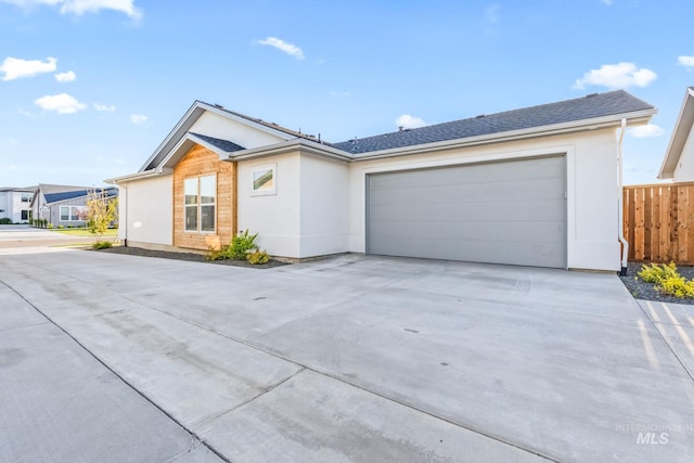8456 W Meltwater Ln, Eagle, ID 83616 - ranch-style house with concrete driveway, stucco siding, and an attached garage