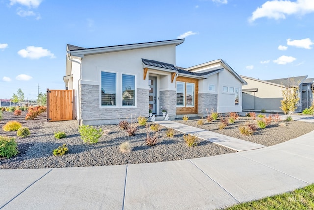 8456 W Meltwater Ln, Eagle, ID 83616 - contemporary house with stucco siding and stone siding