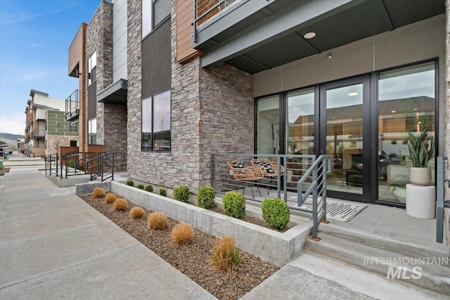 entrance to property with stone siding