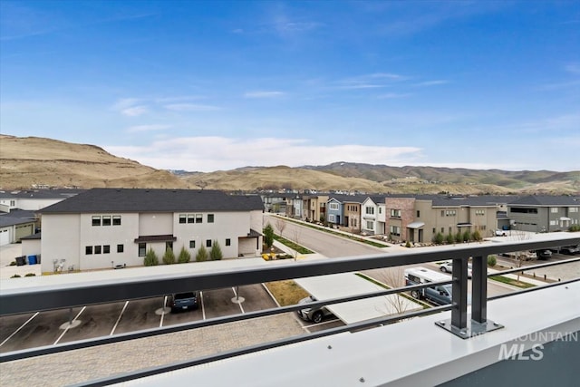 balcony with a mountain view and a residential view