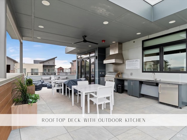exterior space featuring grilling area, ceiling fan, outdoor dining area, a sink, and an outdoor kitchen
