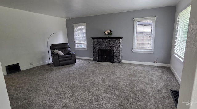 1118 10th St, Lewiston, ID 83501 - unfurnished living room featuring healthy amount of natural light, a premium fireplace, and carpet
