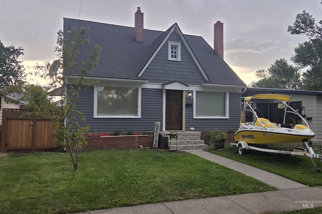 1118 10th St, Lewiston, ID 83501 - bungalow-style home featuring a chimney