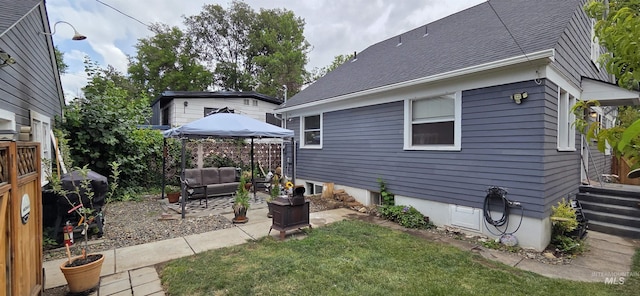 1118 10th St, Lewiston, ID 83501 - view of home's exterior featuring a gazebo, outdoor lounge area, and a patio