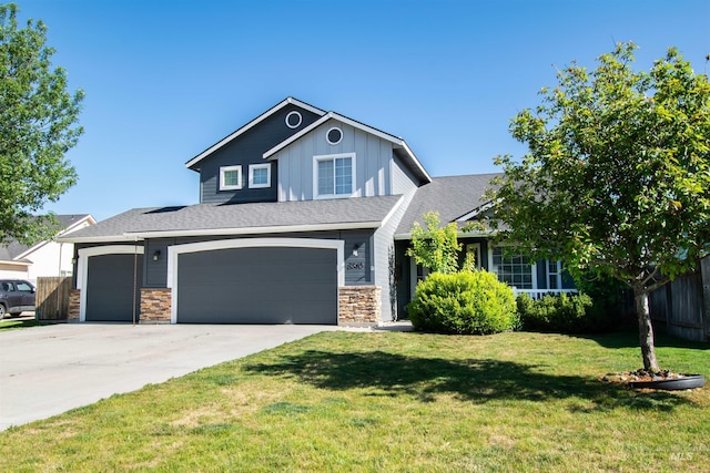 8340 E Expedition, Nampa, ID 83687 - view of front facade with board and batten siding, concrete driveway, a garage, and stone siding